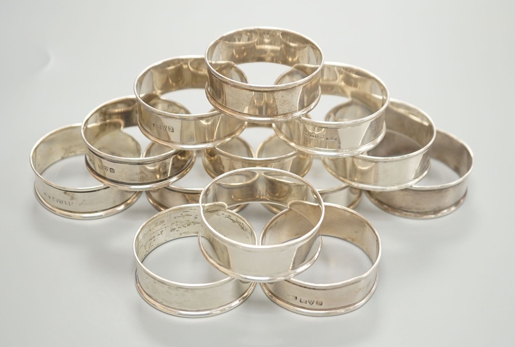 A matched set of thirteen early 20th century plain silver napkin rings, by Charles Horner, Chester, various dates.